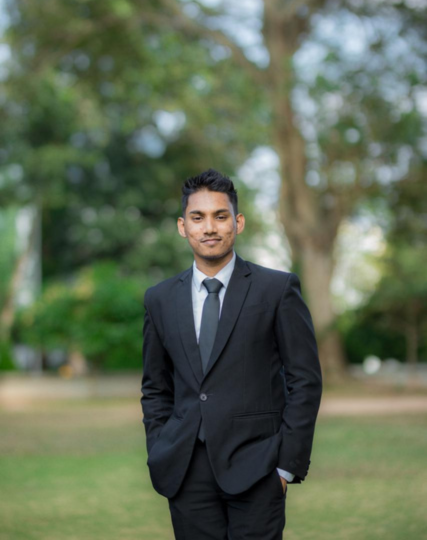Irosh Perera in professional business attire